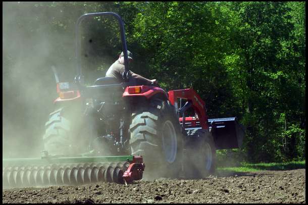 After broadcasting, we used our tractor and cultipacker to prep the soil. We wanted a 1