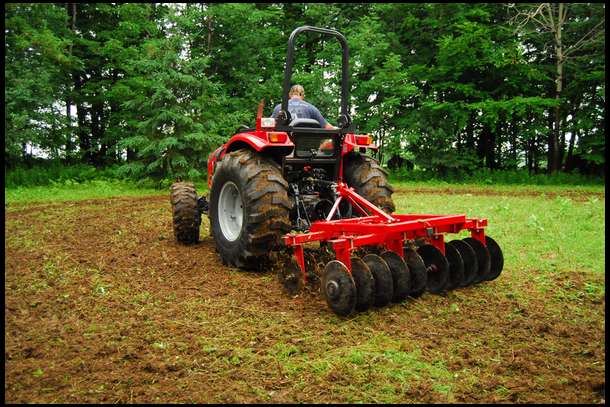 Here I am disking the soil after the stumps and rocks were removed. 