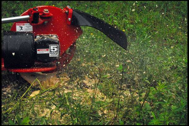 Using our tractor and our McCormick by Woods stump grinder we go to town on the stump. Getting the hang of the stump grinder too a little while, but in no time I had that sucker vaporized!