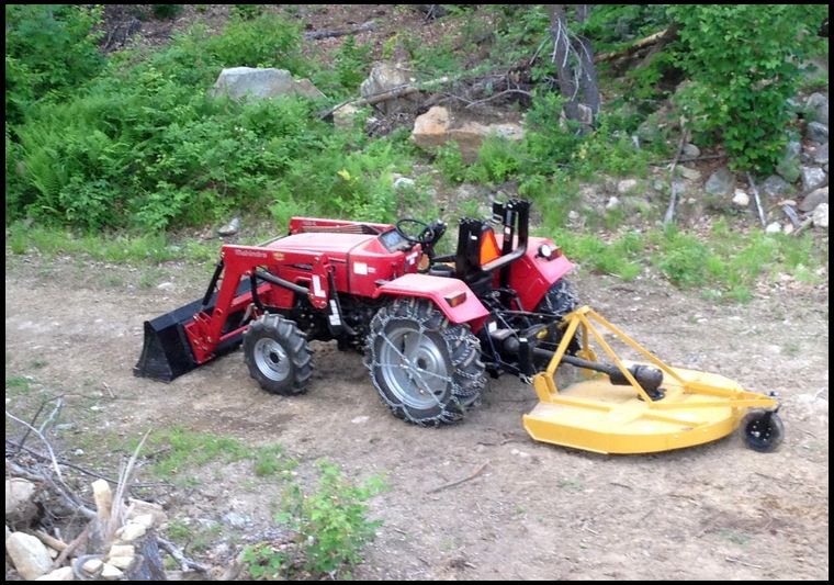 Mahindra 4025 with an everything attachments 5ft rotary cutter.